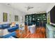 Spacious home office featuring built-in shelving, hardwood floors, and ample seating areas for work or relaxation at 517 Spruce Canyon St, Las Vegas, NV 89144