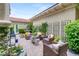 Charming courtyard with outdoor seating, decorative plants, and a serene fountain for relaxation at 517 Spruce Canyon St, Las Vegas, NV 89144