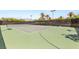 Well-maintained community tennis court with a basketball hoop, perfect for recreational activities and sports at 517 Spruce Canyon St, Las Vegas, NV 89144