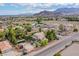 Expansive aerial view of a charming suburban neighborhood nestled against a scenic mountain backdrop at 5180 N Dapple Gray Rd, Las Vegas, NV 89149