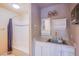 Bathroom featuring a tub/shower combination and vanity with a marble countertop, offering functionality at 5180 N Dapple Gray Rd, Las Vegas, NV 89149