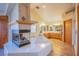 Bathroom with a jacuzzi tub, fireplace, and dual sinks offering a luxurious and relaxing space at 5180 N Dapple Gray Rd, Las Vegas, NV 89149