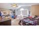 Bright bedroom featuring vaulted ceilings, modern furniture, and natural light from large window at 5180 N Dapple Gray Rd, Las Vegas, NV 89149