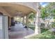 Large covered patio with ceiling fans, bar area, grill, and open views of the backyard at 5180 N Dapple Gray Rd, Las Vegas, NV 89149