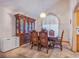 Elegant dining room features a decorative hutch, chandelier and space for entertaining guests at 5180 N Dapple Gray Rd, Las Vegas, NV 89149
