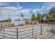 Horse property featuring a horse barn, horse run, storage sheds, and ample space for farm animals at 5180 N Dapple Gray Rd, Las Vegas, NV 89149