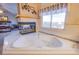 Elegant bathroom featuring a large jacuzzi tub with fireplace, adjacent to a sun-filled window at 5180 N Dapple Gray Rd, Las Vegas, NV 89149