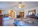 Expansive main bedroom boasts a fireplace, generous closet space, and a ceiling fan at 5180 N Dapple Gray Rd, Las Vegas, NV 89149