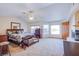 Spacious main bedroom with a fireplace, plush carpet, and ample natural light at 5180 N Dapple Gray Rd, Las Vegas, NV 89149