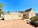 Backyard view of the home, highlighting the exterior and minimalist desert landscape design at 5215 Gray Ln, Las Vegas, NV 89119