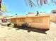 Single-story home's backyard showing desert landscaping and exterior wall features at 5215 Gray Ln, Las Vegas, NV 89119