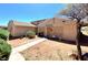 A cozy, single-story home showcasing desert landscaping and a secure front entrance at 5215 Gray Ln, Las Vegas, NV 89119