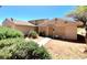 Charming single-story home with a secure front entry and desert-friendly landscaping at 5215 Gray Ln, Las Vegas, NV 89119