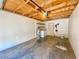 Spacious garage with laundry hookups, exposed rafters, and shelving at 5215 Gray Ln, Las Vegas, NV 89119