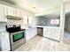 Modern kitchen features sleek stainless steel appliances, bright white cabinets, and durable countertops at 5215 Gray Ln, Las Vegas, NV 89119