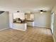 Bright living area featuring tile floors connecting to the kitchen with ample natural light at 5215 Gray Ln, Las Vegas, NV 89119
