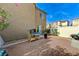 Enclosed backyard featuring a white fence, tasteful gravel and drought tolerant landscaping at 5228 Fire Night Ave, Las Vegas, NV 89122
