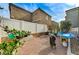 Enclosed backyard featuring a white fence, tasteful gravel and drought tolerant landscaping at 5228 Fire Night Ave, Las Vegas, NV 89122