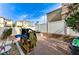Enclosed backyard featuring a white fence, tasteful gravel and drought tolerant landscaping at 5228 Fire Night Ave, Las Vegas, NV 89122