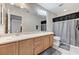 Bright bathroom featuring double sinks, vanity cabinets, and tile flooring at 5228 Fire Night Ave, Las Vegas, NV 89122