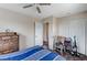 Cozy bedroom features closet with a ceiling fan and vintage dresser at 5228 Fire Night Ave, Las Vegas, NV 89122
