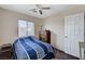 Bedroom featuring a ceiling fan, natural light, and wooden dresser at 5228 Fire Night Ave, Las Vegas, NV 89122