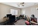 Bedroom with a ceiling fan, window, and a work desk at 5228 Fire Night Ave, Las Vegas, NV 89122