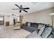 Comfortable living room featuring neutral tile flooring and an overhead ceiling fan at 5228 Fire Night Ave, Las Vegas, NV 89122