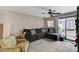 Comfortable living room with tile flooring and large couch with throw pillows at 5228 Fire Night Ave, Las Vegas, NV 89122