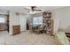 Living room and dining nook featuring tile floors, ceiling fan, and stairs at 5228 Fire Night Ave, Las Vegas, NV 89122