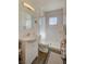 Clean bathroom with walk-in shower, white vanity, and neutral-toned walls and floors at 533 Date St, Boulder City, NV 89005