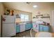 Bright kitchen showcasing blue cabinets, modern appliances, and eye-catching decor for a cheerful space at 533 Date St, Boulder City, NV 89005