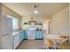 Cozy kitchen featuring blue cabinets, breakfast area, and updated appliances, blending style and functionality at 533 Date St, Boulder City, NV 89005
