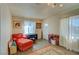 Inviting living room with red armchair, decorative rug, and window, creating a warm atmosphere at 533 Date St, Boulder City, NV 89005