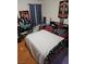 A quirky bedroom featuring unique decor, dark furniture and a cozy bed with patterned bedding at 555 E Silverado Ranch Blvd # 2028, Las Vegas, NV 89183