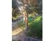 Scenic view of the community landscaping with mature trees and walkways at 555 E Silverado Ranch Blvd # 2028, Las Vegas, NV 89183
