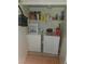 Convenient laundry area with washer, dryer, and built-in shelving for storage at 555 E Silverado Ranch Blvd # 2028, Las Vegas, NV 89183