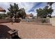 This cozy backyard features a low-maintenance landscape with a gravel-covered ground and block fence at 5638 Morning Song Cir, North Las Vegas, NV 89031