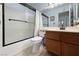 Bathroom features tub and shower combination, tiled floors, and wood vanity at 5638 Morning Song Cir, North Las Vegas, NV 89031