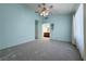 This carpeted bedroom features an attached bathroom with dual sinks and a window at 5638 Morning Song Cir, North Las Vegas, NV 89031