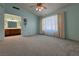This carpeted bedroom has a bathroom with dual sinks and natural light at 5638 Morning Song Cir, North Las Vegas, NV 89031