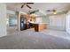 Bright kitchen features tile floors, wood cabinets, updated appliances, and breakfast bar for additional seating and storage at 5638 Morning Song Cir, North Las Vegas, NV 89031