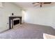 Bright living room featuring a fireplace, carpet flooring and neutral wall colors at 5638 Morning Song Cir, North Las Vegas, NV 89031