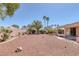 Backyard featuring desert landscaping, trees, and patio cover at 5808 Spinnaker Reach Ave, Las Vegas, NV 89130