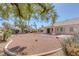 View of a low maintenance desert rock backyard with covered patio of this single story home at 5808 Spinnaker Reach Ave, Las Vegas, NV 89130