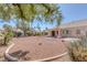 View of a low maintenance desert rock backyard with covered patio of this single story home at 5808 Spinnaker Reach Ave, Las Vegas, NV 89130