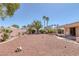 Backyard featuring desert landscaping, trees, and patio cover at 5808 Spinnaker Reach Ave, Las Vegas, NV 89130