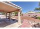 A shaded patio area leads to a xeriscaped backyard in this inviting outdoor living space at 5808 Spinnaker Reach Ave, Las Vegas, NV 89130