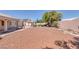 Backyard featuring desert landscaping, pergola, and block wall at 5808 Spinnaker Reach Ave, Las Vegas, NV 89130
