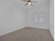 Neutral bedroom featuring vaulted ceilings, window with white shutters, and neutral carpet at 5808 Spinnaker Reach Ave, Las Vegas, NV 89130